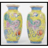 A pair of 19th century Canton Enamel Chinese miniature vases having a famille Juan ground with