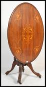 A Victorian 19th century walnut marquetry inlaid tilt top loo / breakfast dining table. Raised on