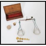 A set of 19th century Victorian small portable Chemist / gold weighing scales complete in wooden box