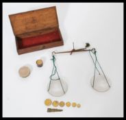 A set of 19th century Victorian small portable Chemist / gold weighing scales complete in wooden box