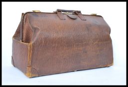 An early 20th century medium sized tooled faux leather gladstone bag by Cross of London. Complete