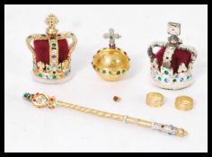 The Royal Crown Jewels - A miniature replica of the crown jewels in fitted presentation box.