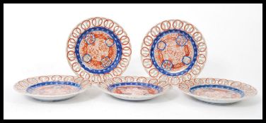 A set of five 19th century Chinese Imari reticulated plates having ribbon edges. Hand painted in