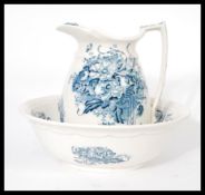 A 19th century Victorian Bristol makers jug and washbowl set having blue and white floral