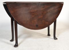 A 19th century George III solid mahogany pad foot / drop leaf dining table of smaller proportions.