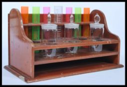 A vintage retro 20th century Scientific test tube rack holder with various scientific glass phials
