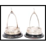 A pair of silver hallmarked novelty wishbone menu holders raised on circular bases. Hallmarked for