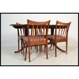 A set of four vintage retro 20th century Greaves and Thomas dining chairs raised on tapering legs