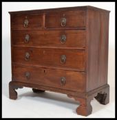 A 19th century Georgian mahogany two over three chest of drawers. The bank of drawers raised on