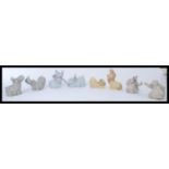 A group of Nao ( Lladro ) figurines of animals to include pair of apes, lions and cubs, elephants