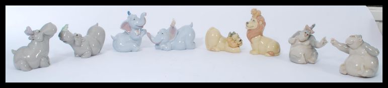 A group of Nao ( Lladro ) figurines of animals to include pair of apes, lions and cubs, elephants