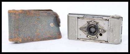 A vintage Ensign Midget miniature photographic bellows camera in silver finish complete in leather