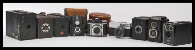 A group of vintage cameras to include Kodak No 2A Brownie model B, Six-20 Brownie C Six-20 popular