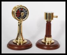 Two vintage style nautical ship instruments - one being an engine room telegraph ships speed dial on