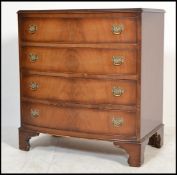 A reproduction Georgian style Regency revival flame mahogany chest of drawers. The bank of four