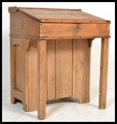A 19th century Victorian pine Davenport  shaped country clerks desk having a sloped opening disk