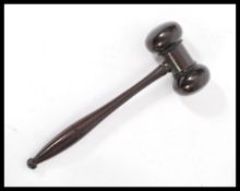 A 19th century Victorian rosewood gavel having a tapered handle with turned gavel top. Measures