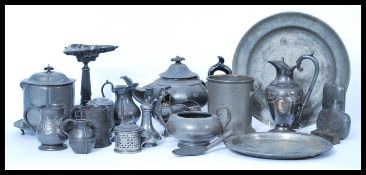 A collection of pewter dinner / tea set wares dating from the 19th century to include large
