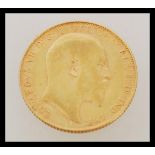 An early 20th century George V full sovereign gold coin dated 1907. Weighs 7.98 grams.
