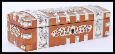 A 19th century Indian fruit wood anglo - colonial box having inlaid ivory panels depicting flowers