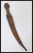 A 19th century Mongolian ceremonial dress dagger having a copper handle and sheaf with inset coral