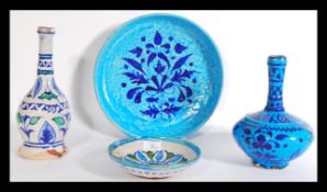 A collection of four Persian / Islamic glazed pott