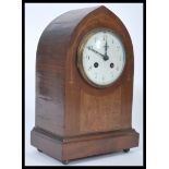 An Edwardian mahogany inlaid spire shaped mantel clock with 8 day brass clock movement, enamel