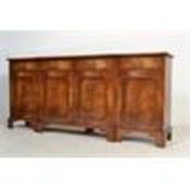 A good flame mahogany large breakfront sideboard being raised on bracket feet with a series of short