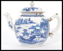 An 18th century Chinese Quanlong period very large blue and white punch pot having a shaped handle