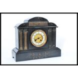 A 19th century Victorian slate marble mantel clock having a white enamel chapter ring with Arabic