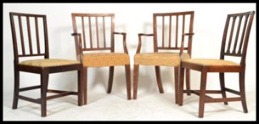A set of 4 19th century Georgian mahogany railed back dining chairs having drop in seats being