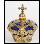 A brass pin cushion in the form of a crown having