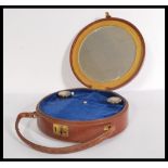A vintage early 20th century round leather bag hav
