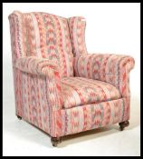 A good 19th century wingback armchair in the manne