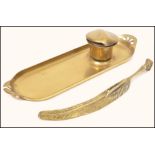 A 19th century brass pen tray with fitted inkwell