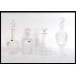A group of vintage cut crystal glass decanters to