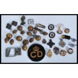 A collection of Military buttons, cap badges, Civi