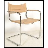 A retro style chrome cantilever dining chair with