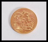 A George V 1913 gold sovereign coin with Bust Fron