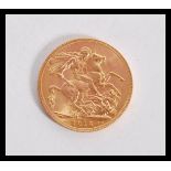 A George V 1913 gold sovereign coin with Bust Fron