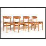 A set of 4 vintage mid 20th century teak wood dini