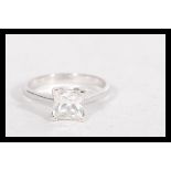 A hallmarked 9ct white gold ring having a square c
