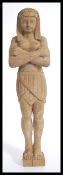 A large early 20th century carved wooden figurine