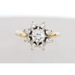 An 18ct gold and diamond cluster ring having a lar