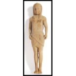 An early 20th century carved wooden figurine of an