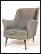 A mid century armchair in the manner of Robin Day