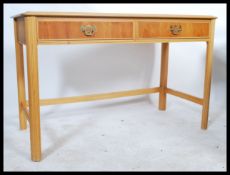 A contemporary 20th Century console table, two dra