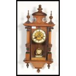 A 19th century Victorian walnut wall clock having