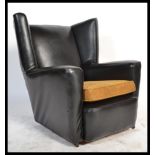 A vintage retro 20th Century wingback angular armc