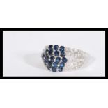 A 14ct white gold blue and white sapphire ring of